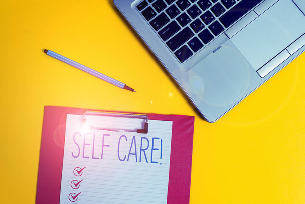 Writing note showing Self Care. Business photo showcasing practice of taking action to preserve or improve ones own health Trendy metallic laptop clipboard paper sheet marker colored background. - Photo, Image