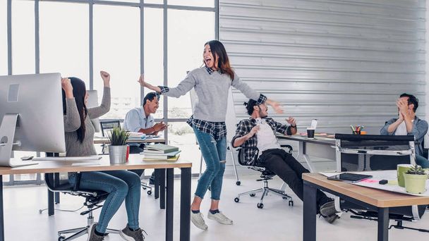 creative designer dancing in office, get good new about promote  - Фото, зображення