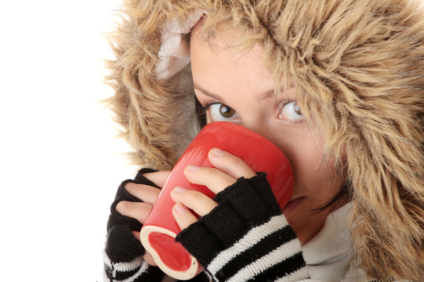 Menina de inverno com copo quente
 - Foto, Imagem
