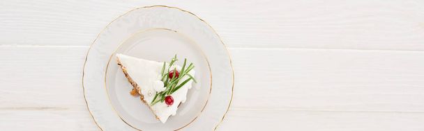 top view of piece of christmas pie on plate on white wooden table  - Fotografie, Obrázek