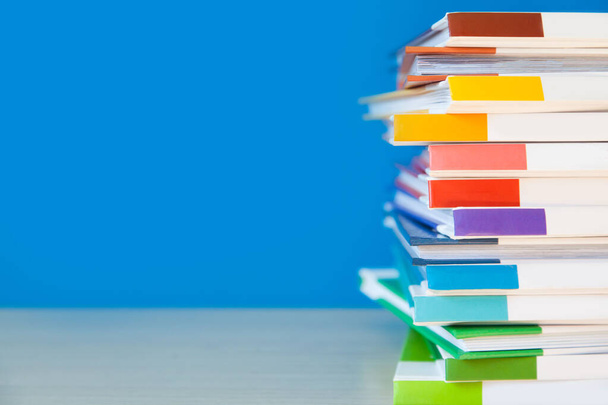 Stack of colorful books on color background.  - Фото, зображення