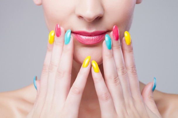 Colored manicure, Woman face with rainbow makeup and manicure - Foto, imagen