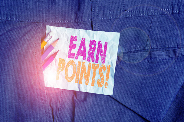 Text sign showing Earn Points. Conceptual photo collecting scores in order qualify to win big prize Writing equipment and white note paper inside pocket of man work trousers. - Photo, Image