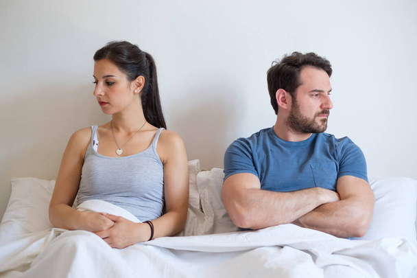 Couple having problem and arguing lying in bed - Photo, Image