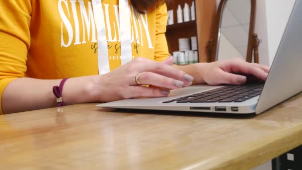 4k Female hands type on laptop keyboard touching touchpad with fingers - Felvétel, videó