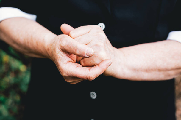 Older woman hands rubbing each other. Elderly people concept - Foto, Imagem
