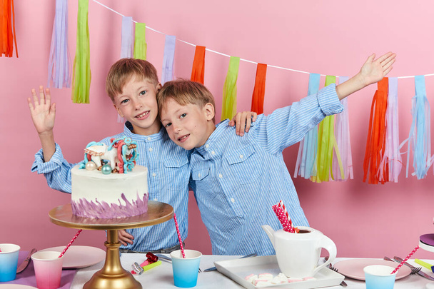 Cute little twins having fun at birthday party - Foto, afbeelding