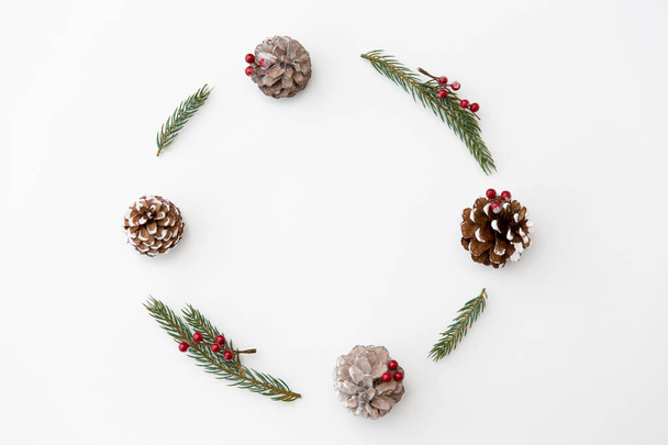 christmas frame of fir branches with pine cones - Photo, image