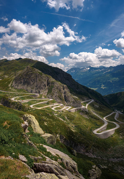 Aerial view of an old road going through the St. Gotthard pass in the Swiss Alps - Fotó, kép