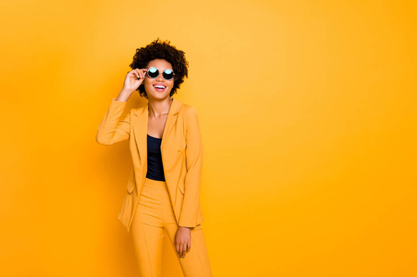 Portrait of her she nice fashionable attractive luxurious cheerful cheery wavy-haired girl touching specs isolated over bright vivid shine vibrant yellow color background - Fotografie, Obrázek