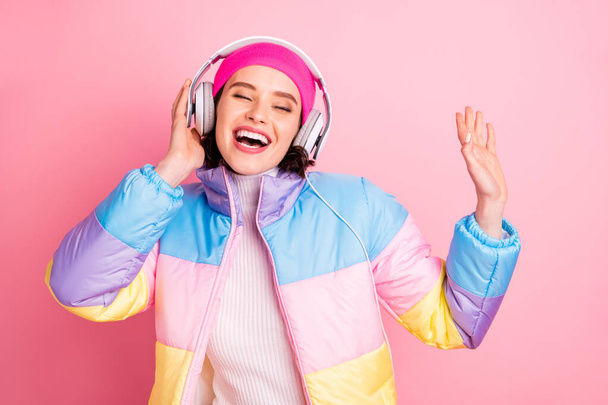 Portrait of her she nice attractive winsome cheerful cheery glad girl enjoying new romance track audio player hobby isolated over pink pastel background - Fotó, kép