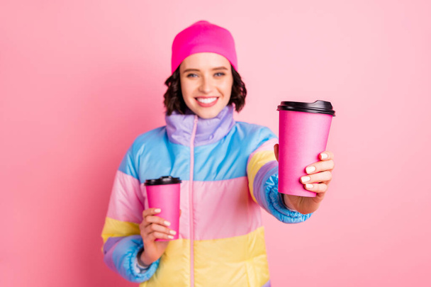 Portrait of her she nice attractive cheerful cheery girl holding in hands two take-out cups of green herbal tea giving to you isolated over pink pastel background - Photo, Image