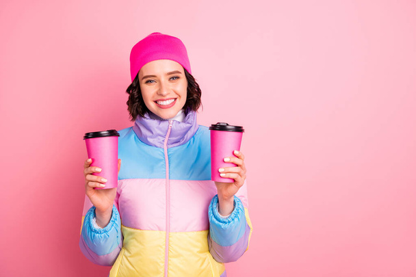 Portrait of her she nice attractive lovely cheerful cheery girl holding in hands two take-away cups of green tea isolated over pink background - Photo, Image