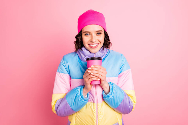 Closeup photo of beautiful lady holding hands hot take out beverage wear warm colored coat isolated pink background - Photo, Image