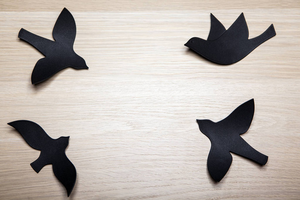 paper bird wooden table background  - Фото, изображение