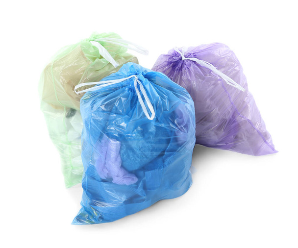 Full plastic garbage bags isolated on white - Foto, Bild