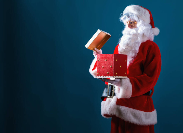 Santa opening a gift box - Photo, Image