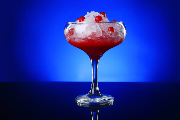 Glass of tasty cocktail on dark color background - Φωτογραφία, εικόνα
