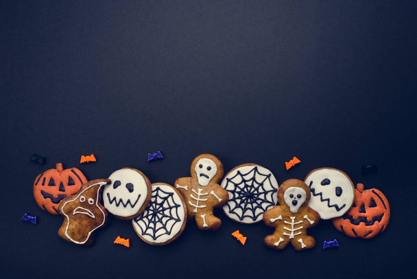 Halloween gingerbread cookies on black background. - Photo, Image