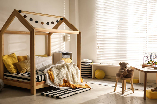 Cozy child room interior with comfortable bed - Valokuva, kuva