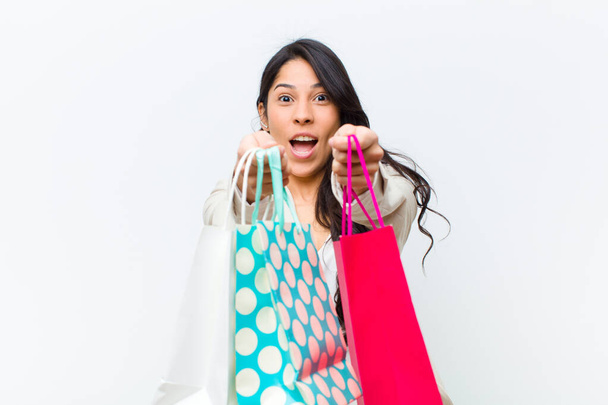 young hispanic pretty woman with shopping bags - Fotó, kép