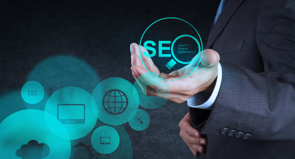 business man hand showing search engine optimization SEO
 - Фото, изображение