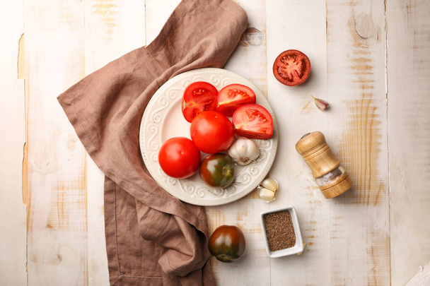 Plate with fresh tomatoes on wooden table - Photo, Image
