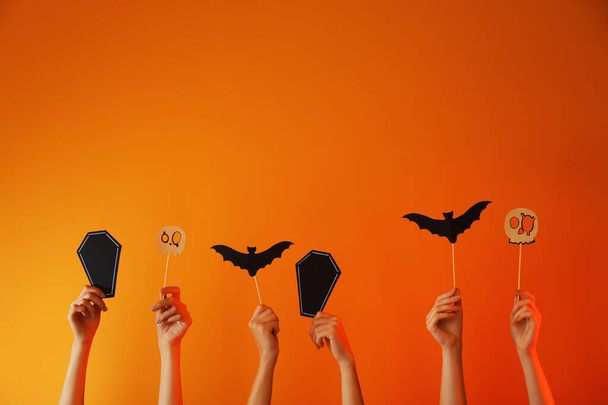 Many hands with Halloween decor on color background - Photo, Image