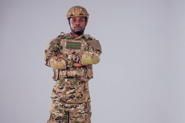 military army african male camouflage suit sorrow white background studio - Zdjęcie, obraz