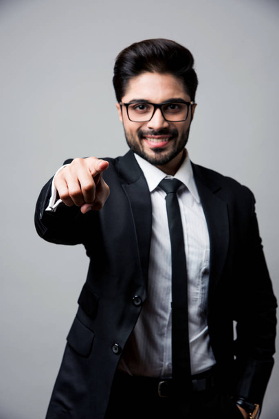 Indian businessman pointing at you, standing isolated over white background - Foto, Imagem