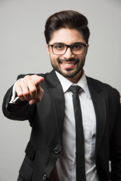 Indian businessman pointing at you, standing isolated over white background - Zdjęcie, obraz