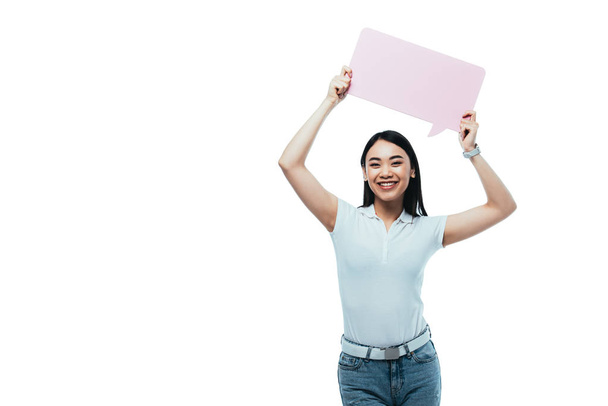 happy attractive asian girl holding pink blank speech bubble isolated on white - Φωτογραφία, εικόνα
