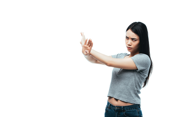 displeased asian girl showing stop gesture isolated on white - Φωτογραφία, εικόνα