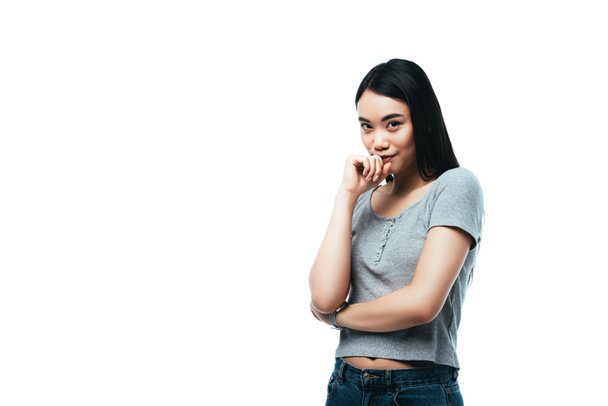 shy asian girl looking at camera isolated on white - Φωτογραφία, εικόνα