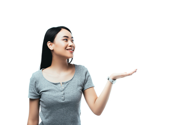白人に手を差し伸べるアジア系の女の子の笑顔 ロイヤリティフリー写真 画像素材