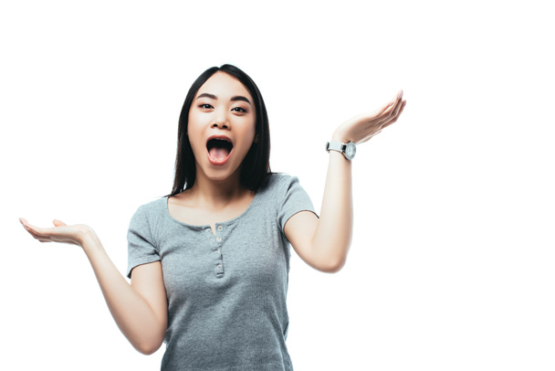 excited asian girl gesturing with open mouth isolated on white - Fotografie, Obrázek