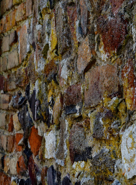 Very old brick wall mixed materials close up - Photo, Image