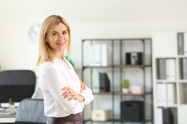 Portrait of beautiful businesswoman in office - Photo, Image