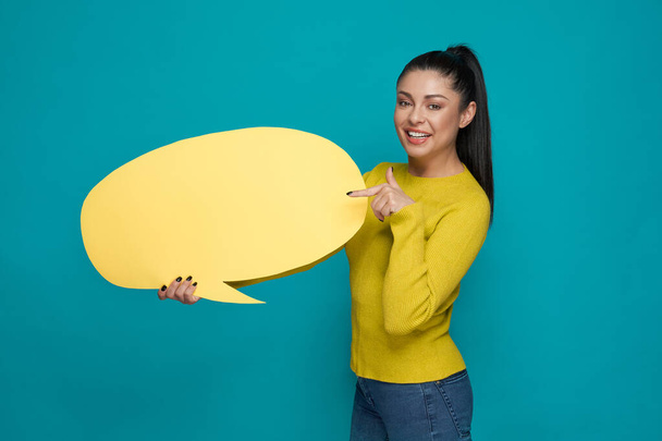 Smiling brunette posing with big cloud for messages - Photo, image