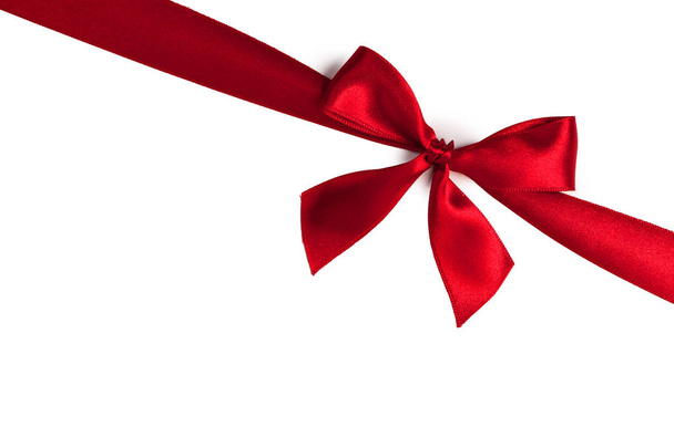 Fiocco regalo rosso su bianco
 - Foto, immagini