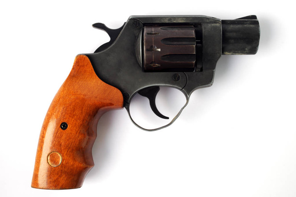 Revolver under flaubert cartridge on a white background close-up - Photo, Image