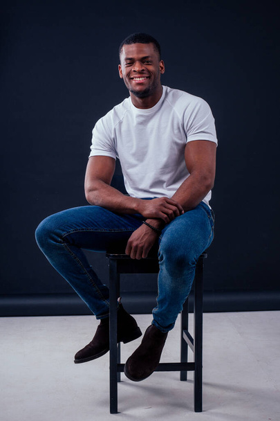 African American healthy male model in a cotton white t-shirt in studio summer lifestyle - 写真・画像