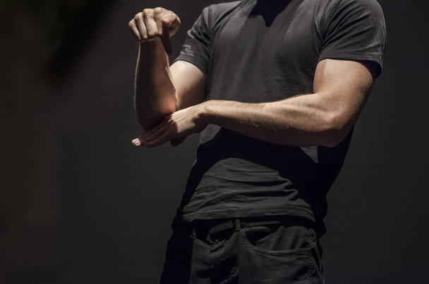 Sign language man interpreter gestures over stage during public  - Photo, Image
