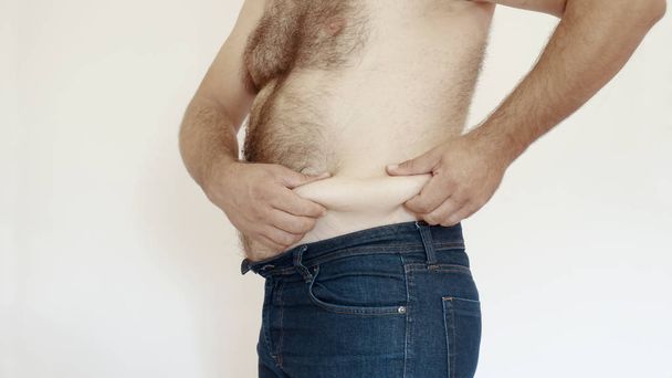 Obese man touching fat belly - Photo, Image