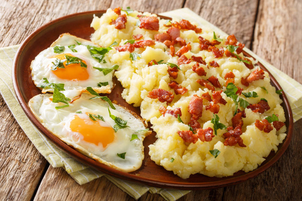 Tasty hot mashed potato with bacon and parsley served with fried - Photo, Image