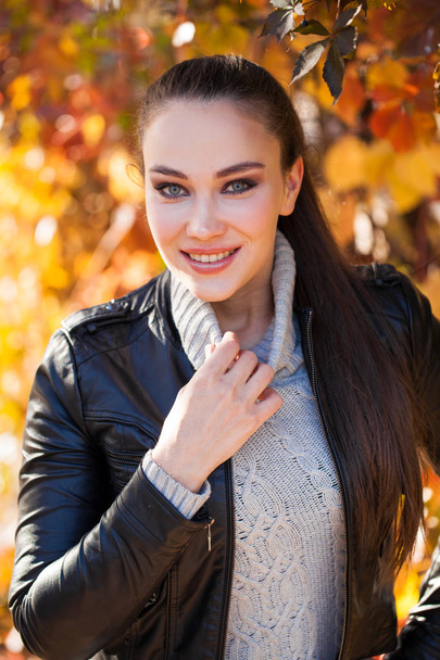 Portrait of a young beautiful model in a black leather jacket  - Fotografie, Obrázek