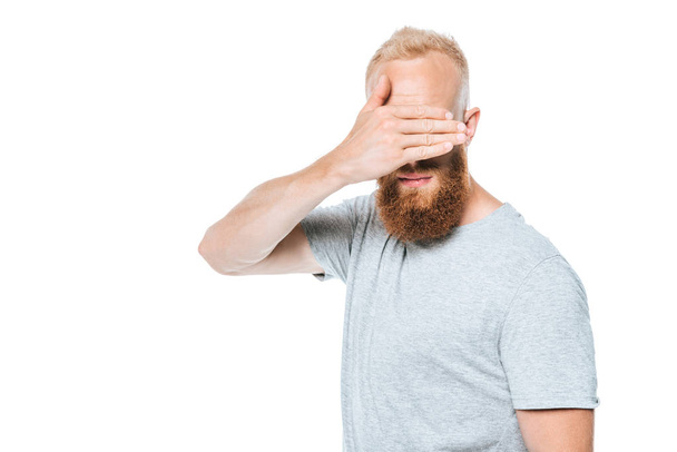 handsome bearded man in grey t-shirt closing eyes, isolated on white - Фото, зображення