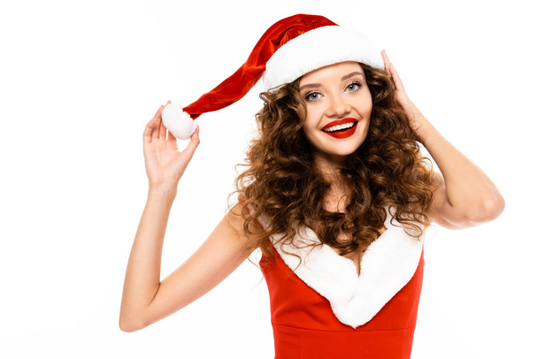 happy girl posing in santa costume and hat, isolated on white - Foto, imagen