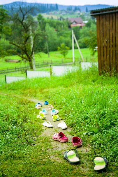 empty childrens shoes on the tropic, concept for travel, adventure, childrens camp - Fotoğraf, Görsel