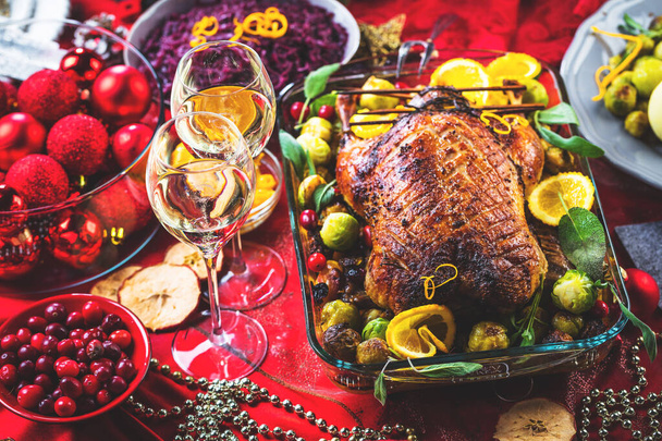 Christmas roasted duck served on a festive table - Foto, imagen